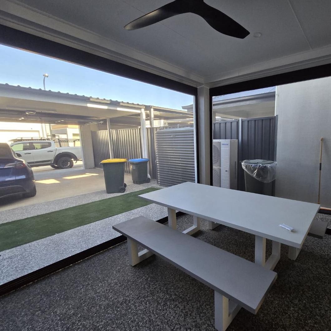 Carport and covered outdoor area with picnic table