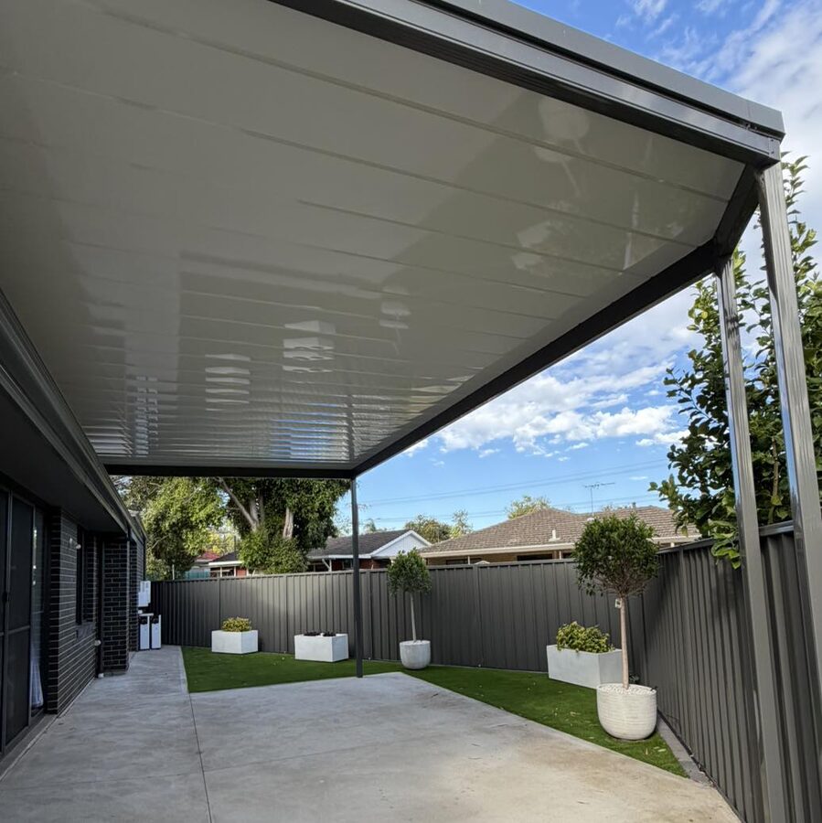 Flat skillion veranda, landscaped modern grey
